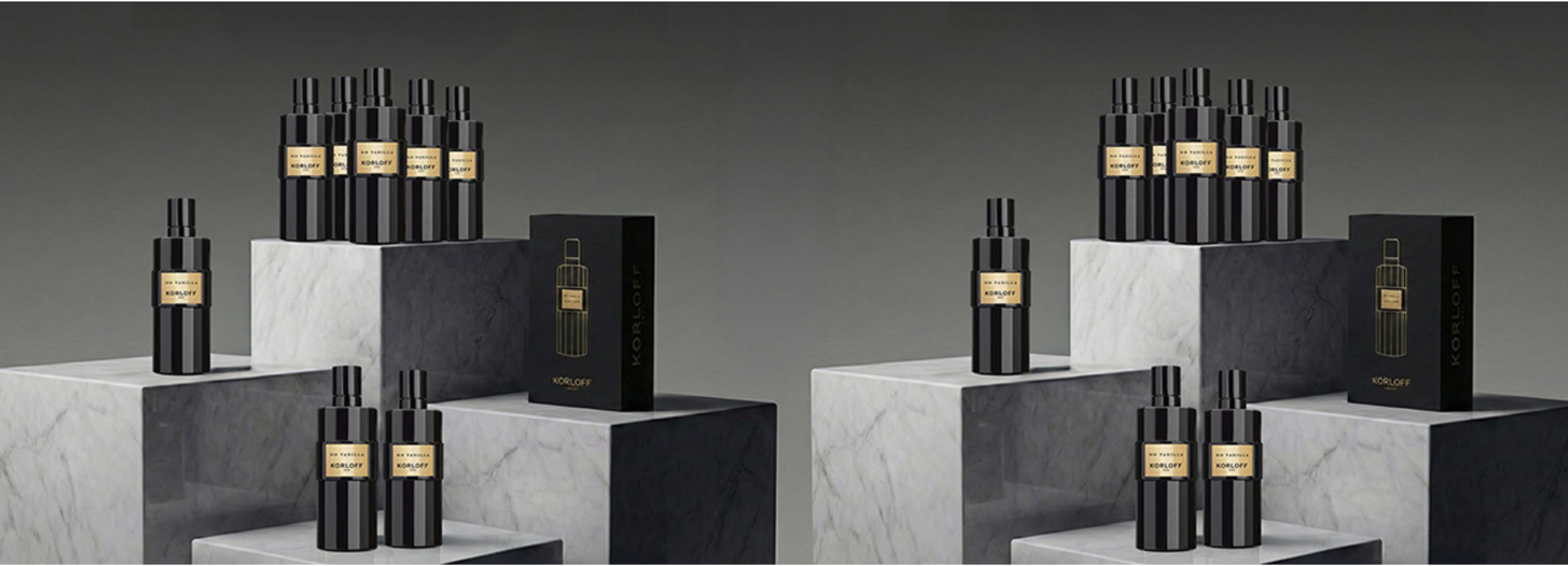 Collezione di profumi Korloff “Mémoire” in flaconi neri e dorati, presentati su piedistalli di marmo
