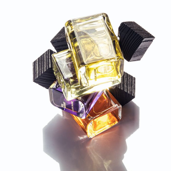 3 bottles of perfumes from MAISON INCENS, stacked on top of one another